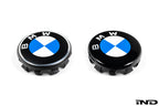 IND Gloss Black Wheel Center Cap Set for BMW, 56mm, featuring Next Dark Design, shown in a comparison image with standard caps.