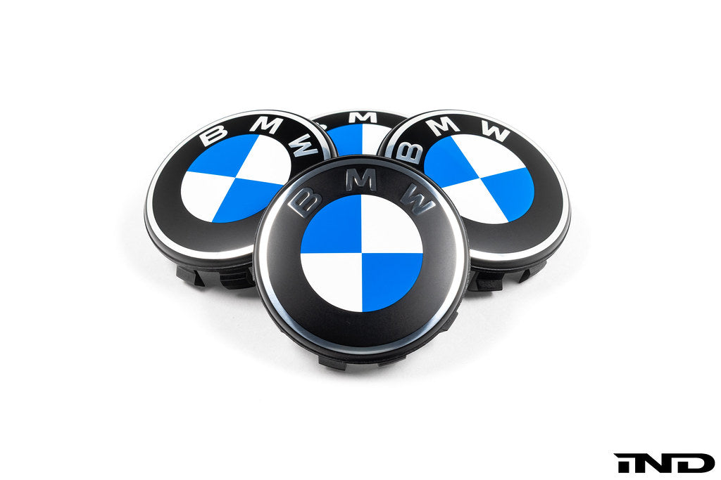 BMW 56mm wheel center caps Next Dark design genuine BMW center caps on white background
