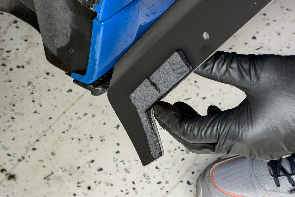 Megachip F90 M5 splash guard set installed on a blue BMW F90 M5, showing exterior protection and fitting details.