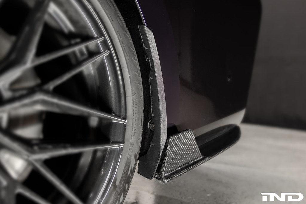 Megachip G20 3-Series splash guards installed on BMW M340i exterior, protecting wheel arches from mud and debris.