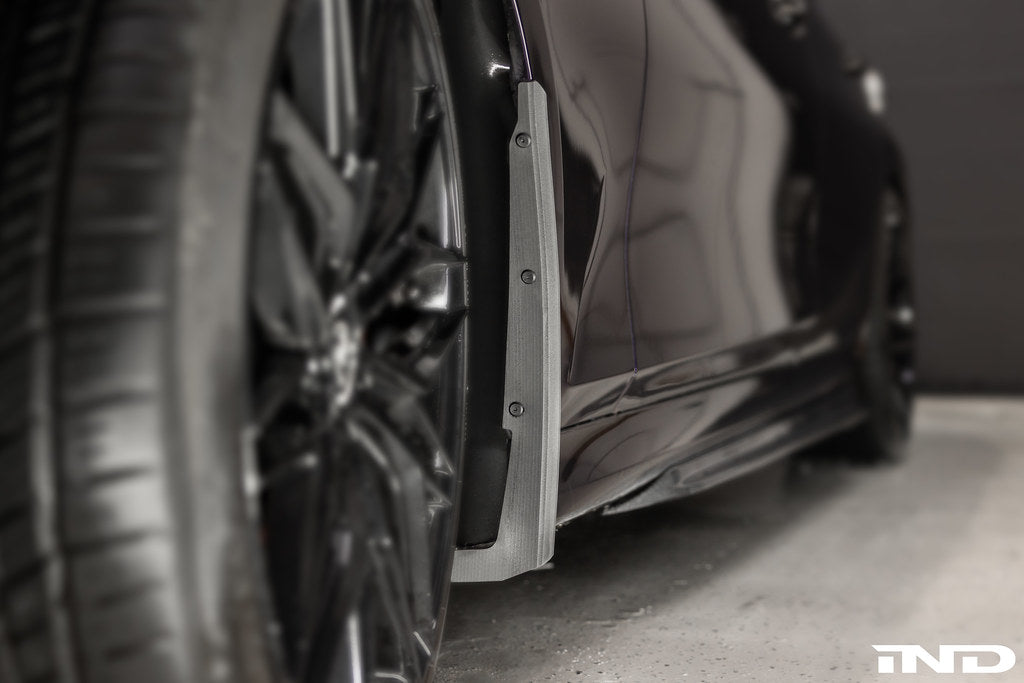 Megachip G20 3-Series splash guards installed on a BMW M340i exterior vehicle, protecting wheels and undercarriage from debris.