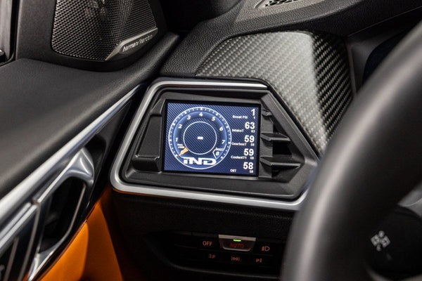 CANchecked MFD32 Gen2 multi function display installed inside BMW G82 M4 interior showing integrated real-time vehicle data and performance monitoring interface.