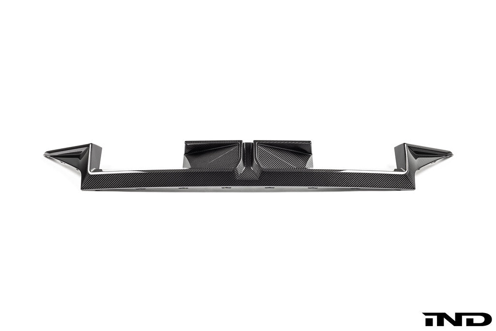 BMW G87 M2 CS exterior carbon rear diffuser showing sleek black carbon fiber with aerodynamic design details