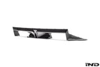 BMW G87 M2 CS exterior carbon rear diffuser showing aerodynamic design and sleek black finish on a sports car.