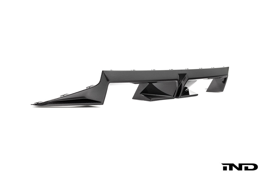 BMW G87 M2 CS exterior carbon rear diffuser, showcasing aerodynamic design and sleek black carbon fiber finish.