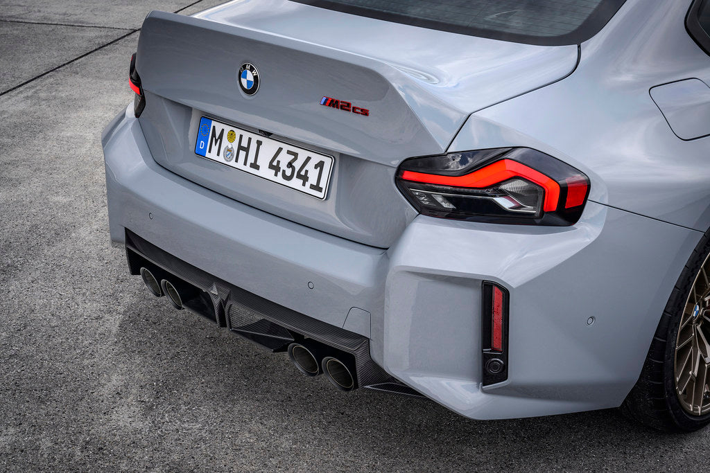 BMW G87 M2 CS exterior carbon rear diffuser installed, showcasing aerodynamic design and sleek black finish.