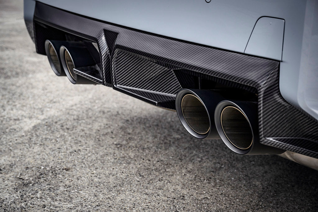 BMW G87 M2 CS exterior carbon rear diffuser installed on the vehicle, showcasing aerodynamic design and high-quality craftsmanship.