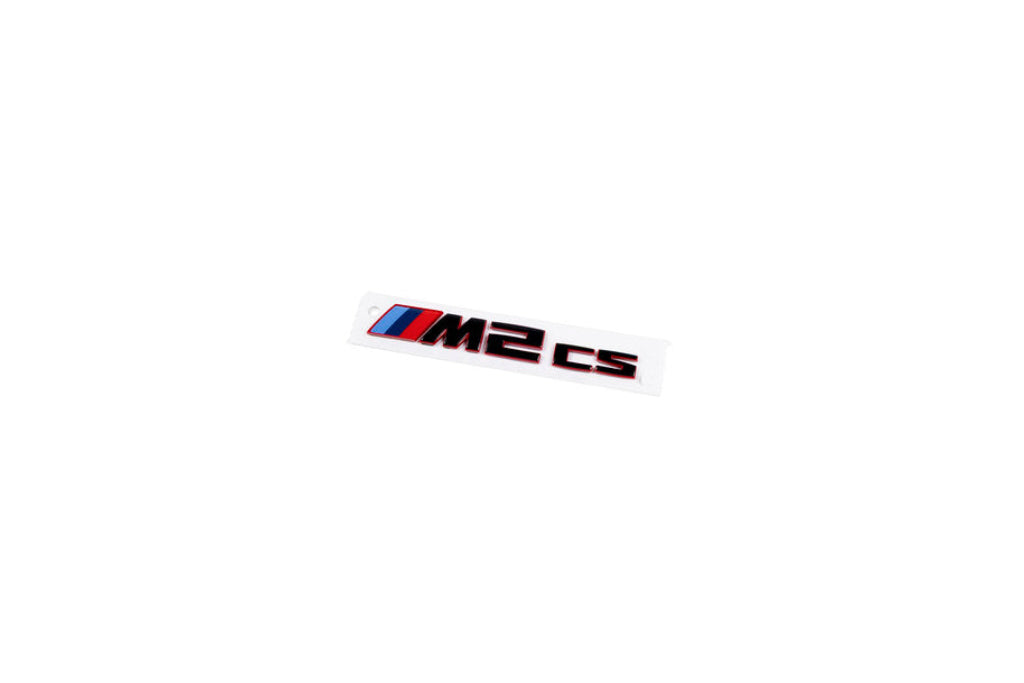 BMW G87 M2 CS exterior front grille emblem in white, showcasing the official BMW badge on the vehicle's front grille.
