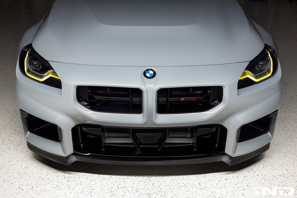 BMW G87 M2 CS exterior front splitter attached to the grille, showcasing a sleek aerodynamic design.