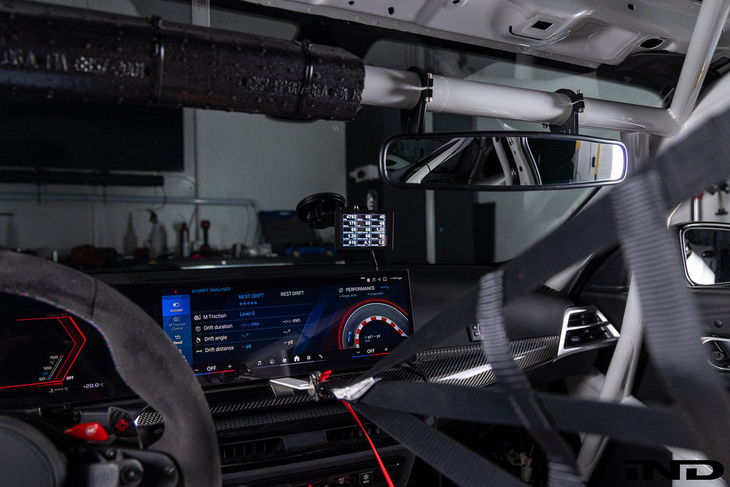 CANchecked MFD32 Gen2 multi-function interior display installed in BMW G87 M2, showing digital gauges and vehicle information.