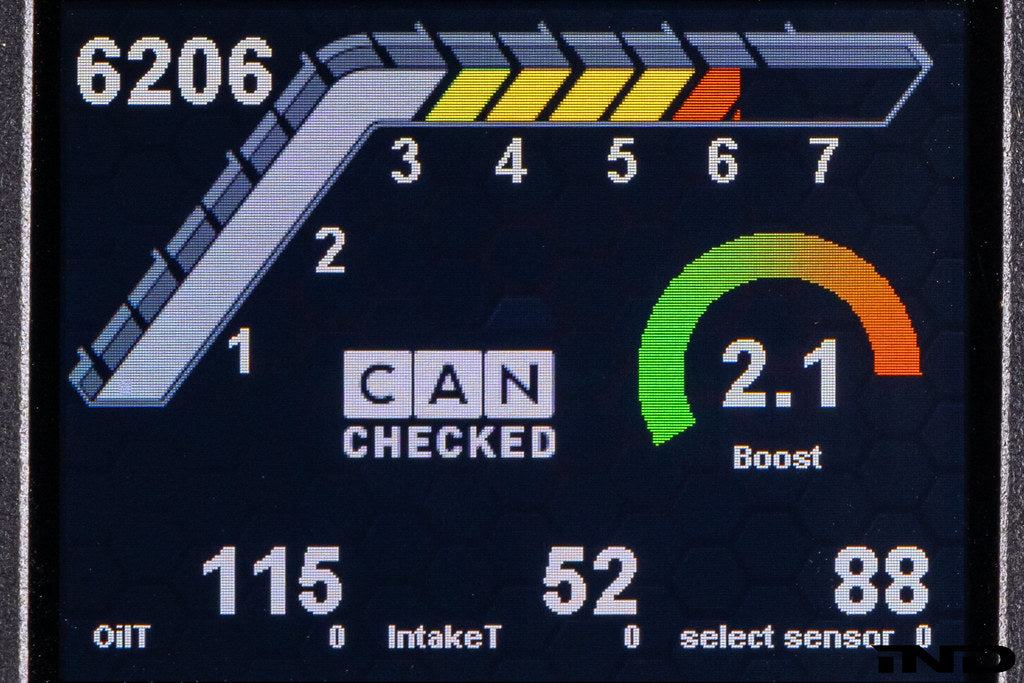 CANchecked MFD32 Multi Function Universal Display Gen2 installed inside BMW G87 M2 Racing showing integrated 3.2-inch motorsport data display mounted within the factory interior cockpit.