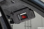 Installed BMW G90 G99 M5 Alcantara European sun visor set in vehicle interior close up visor down vanity light on