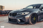 TREVORA BMW F87 M2 OG Pre-Preg Carbon Fiber Front Splitter installed on exterior of 2015-2018 BMW M2.
