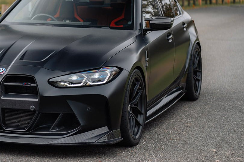 BMW M3 G80 side skirts made of TREVORA G80 M3 Pre-Preg Carbon Fiber PR-1 for exterior enhancement.