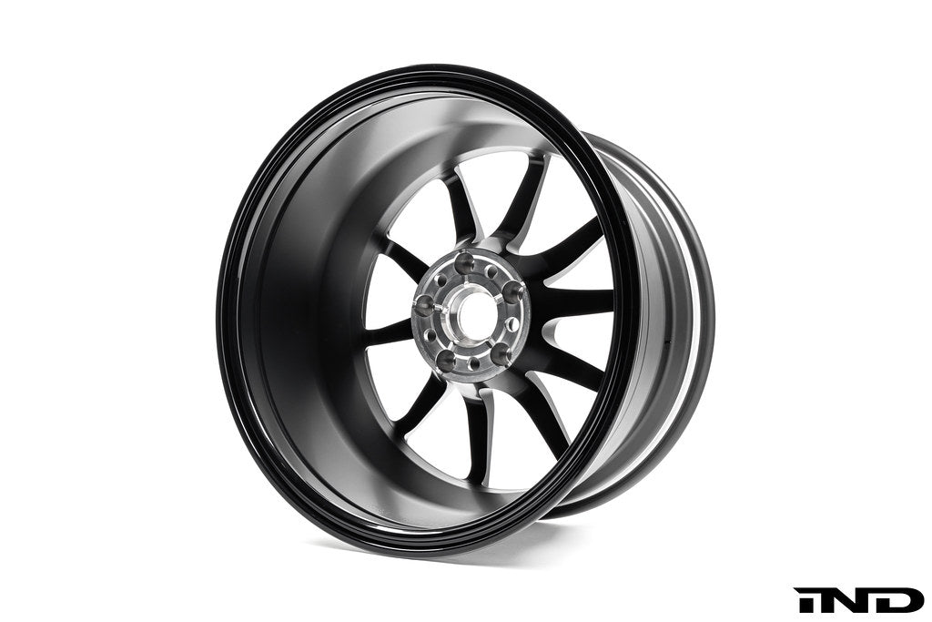 BMW Motorsport G87 M2 racing black 18x10 wheels set shown on a white background, highlighting the sporty design and black finish.