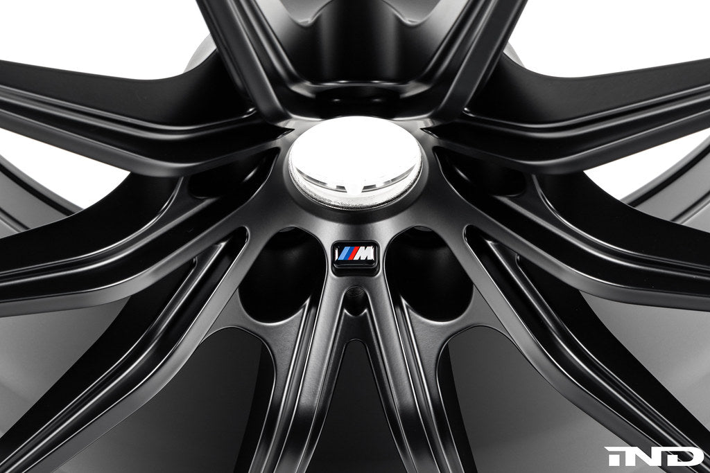 BMW Motorsport G87 M2 racing wheels, 18x10 inches, black finish with a sleek design, displayed on a white background.