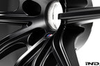 BMW Motorsport G87 M2 racing wheels, 18x10 inches, black finish, lightweight alloy design on white background.