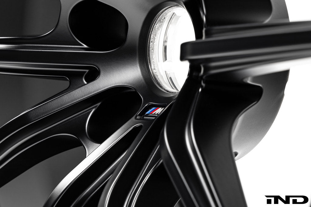 BMW Motorsport G87 M2 racing wheels, 18x10 inches, black finish, lightweight alloy design on white background.