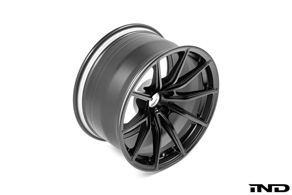 BMW Motorsport G87 M2 racing wheels, 18x10 black alloy wheels with a sleek design, shown on a white background.