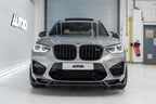 TREVORA BMW F97 X3M and F98 X4M Pre-LCI carbon fiber front splitter installed on the exterior of the vehicle.