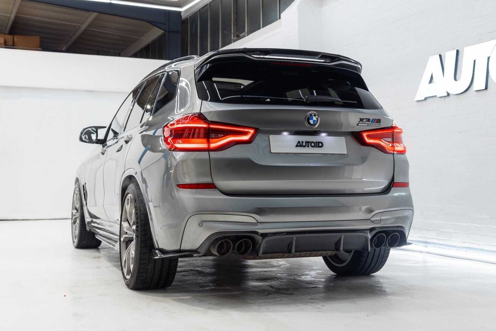 BMW X3M F97 carbon rear roof spoiler by TREVORA, exterior view showing lightweight carbon fiber design on the 2019-2021 model.