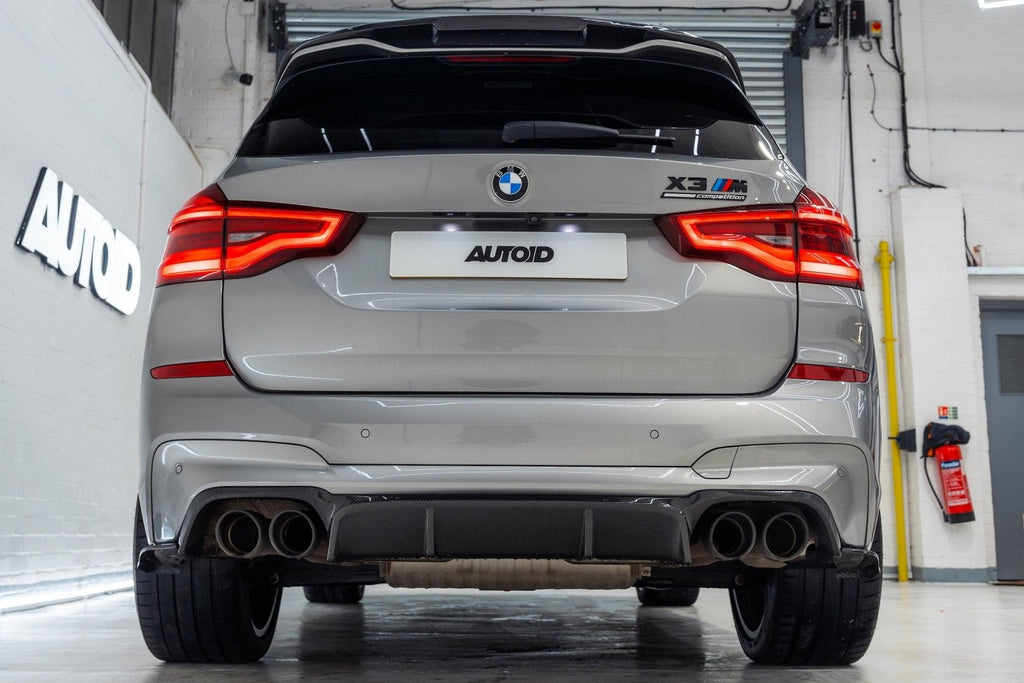BMW X3M F97 carbon rear roof spoiler by TREVORA, exterior view showing sleek carbon fiber design for F97 X3M models 2019-2021