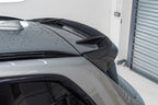 BMW X3M F97 carbon rear roof spoiler by TREVORA, exterior view showing the sleek carbon fiber finish on the roof.