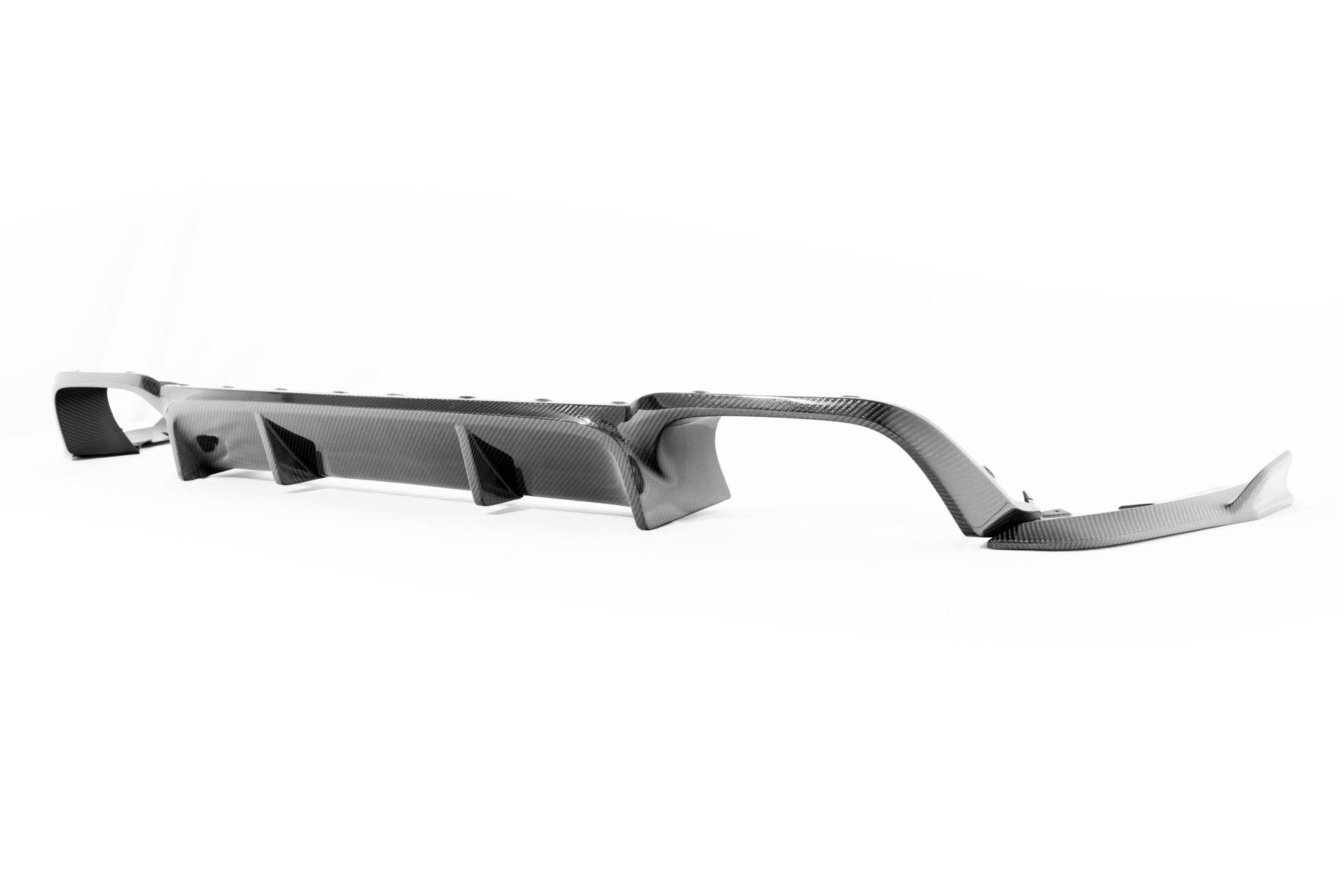 TREVORA BMW F97 X3M carbon fiber rear diffuser installed on the exterior of the 2019-2021 BMW X3M F97.