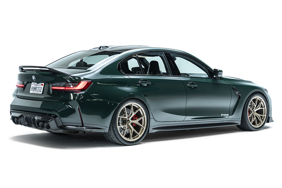 ADRO G80 M3 carbon fiber trunk spoiler installed on a BMW G80 M3 exterior, showcasing sleek aerodynamic design.
