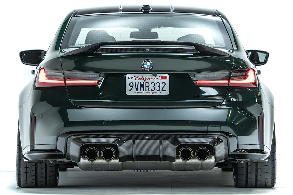 Exterior view of a BMW G80 M3 with ADRO G80 M3 Carbon Trunk Spoiler V2 made of carbon fiber, showcasing its aerodynamic design.