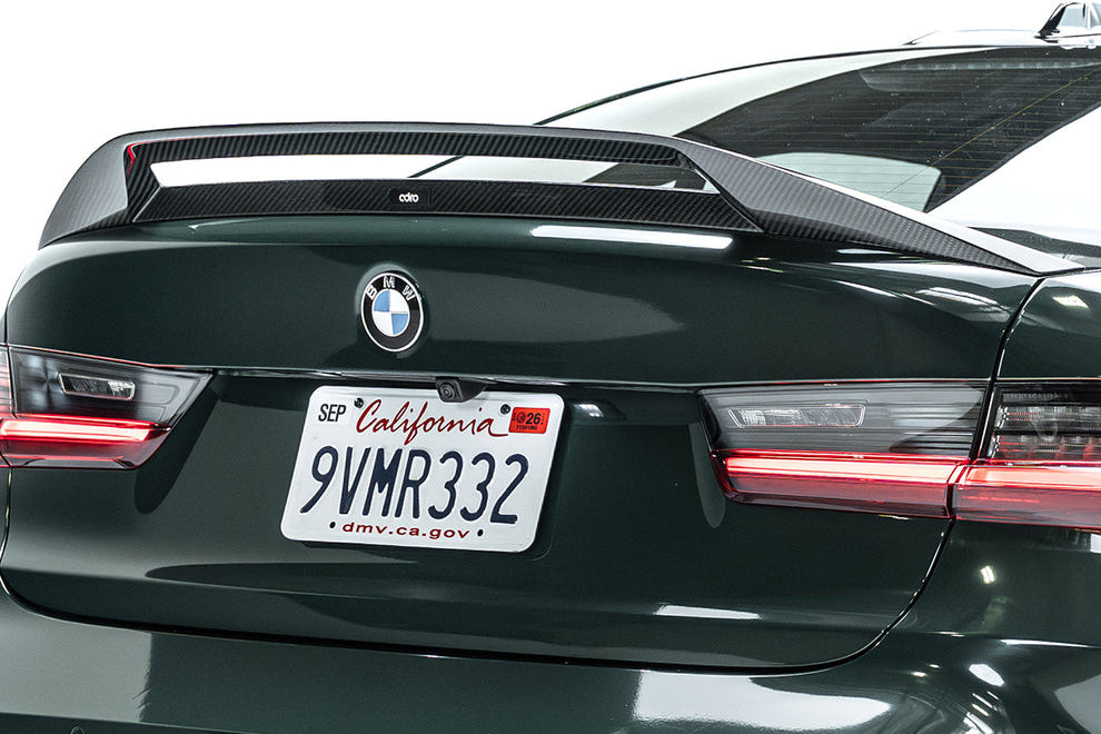 ADRO G80 M3 Carbon Fiber Trunk Spoiler V2 mounted on a BMW G80 M3, showcasing its sleek, lightweight aerodynamic design.