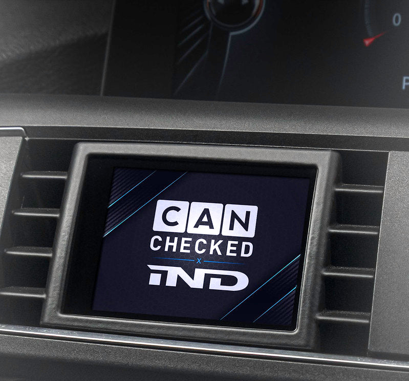 CANchecked multifunction display installed in a BMW F87 M2, providing an OEM-integrated CANbus gauge with real-time engine, boost, temperature, and vehicle performance data.