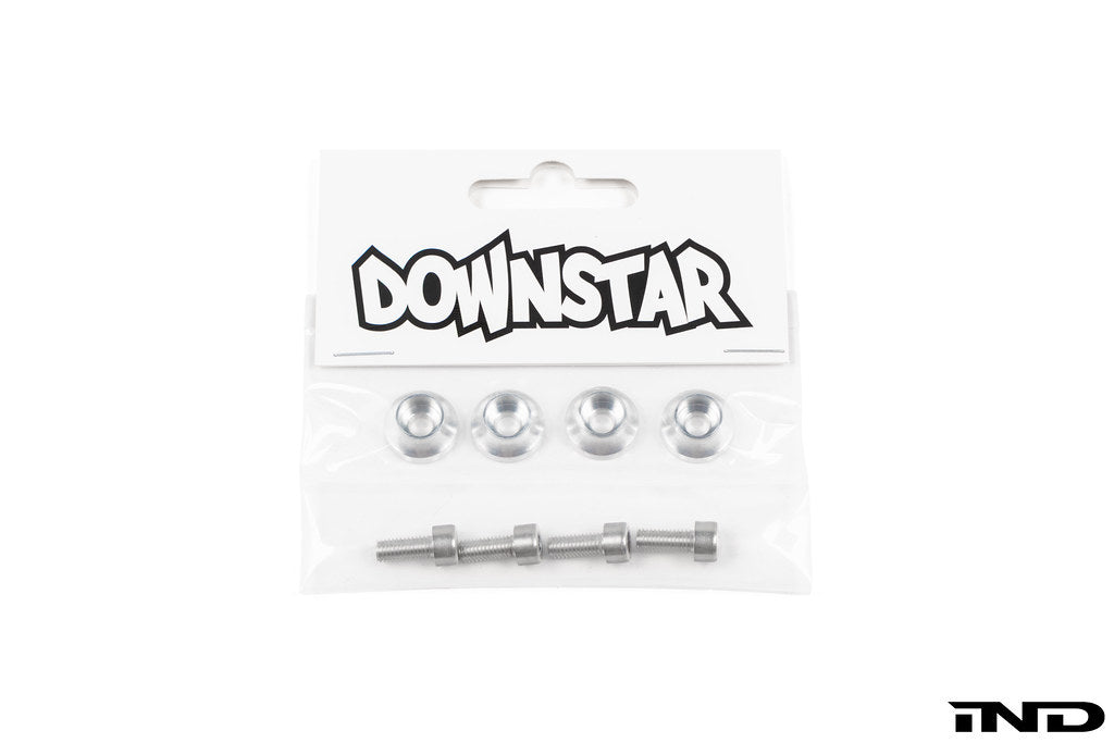 Downstar BMW License Plate Dress Up Hardware package containing stainless steel license plate bolts and billet aluminum beauty washers, displayed on a white background.
