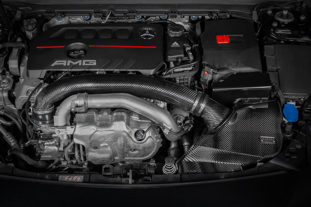 Eventuri black carbon hybrid turbo tube installed in a Mercedes AMG A35 and CLA35, showcasing performance upgrade and sleek design.