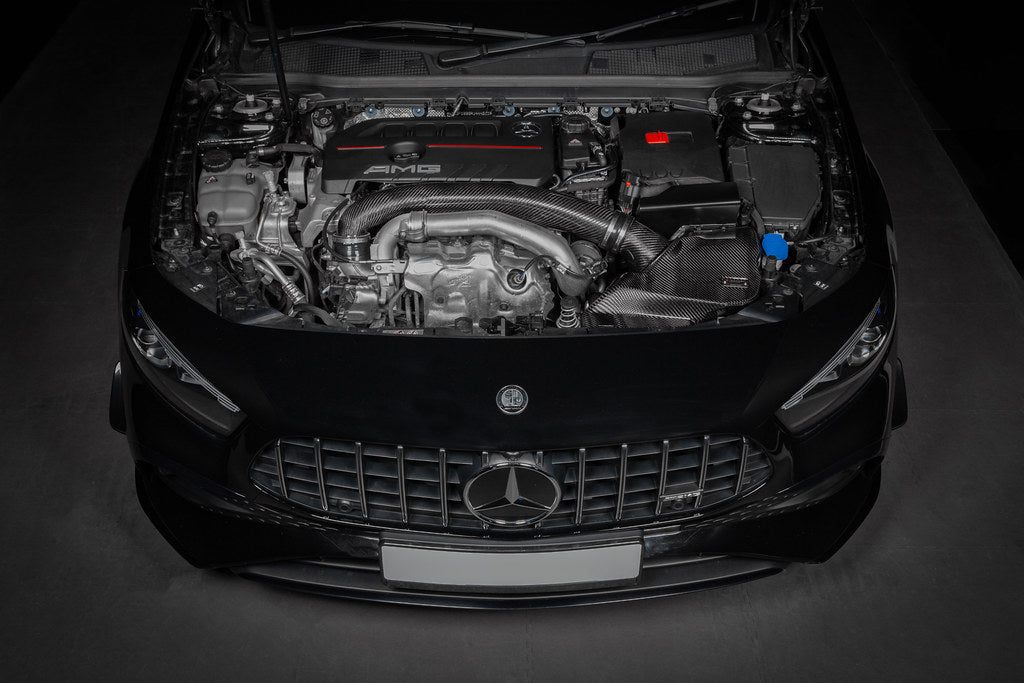 Eventuri black carbon hybrid turbo tube installed in Mercedes AMG A35 and CLA35 performance vehicle, showcasing sleek design and fitment