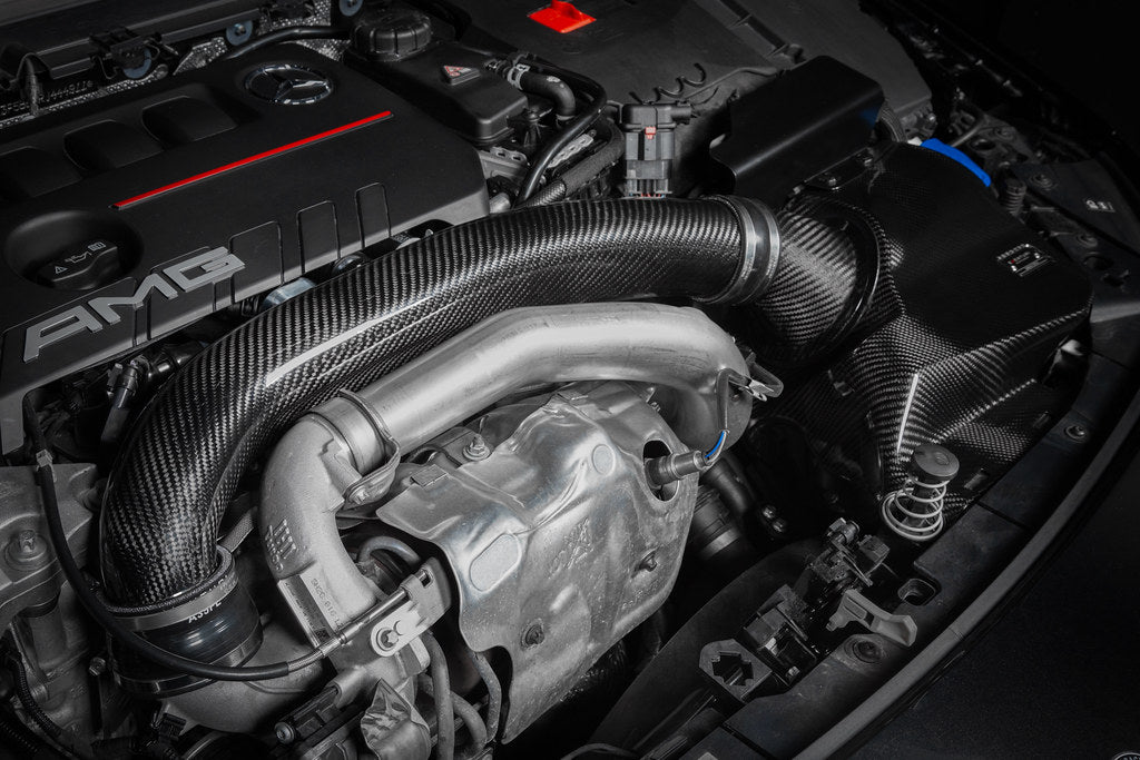 Eventuri black carbon hybrid turbo tube installed on Mercedes AMG A35 and CLA35, performance upgrade for enhanced engine airflow.