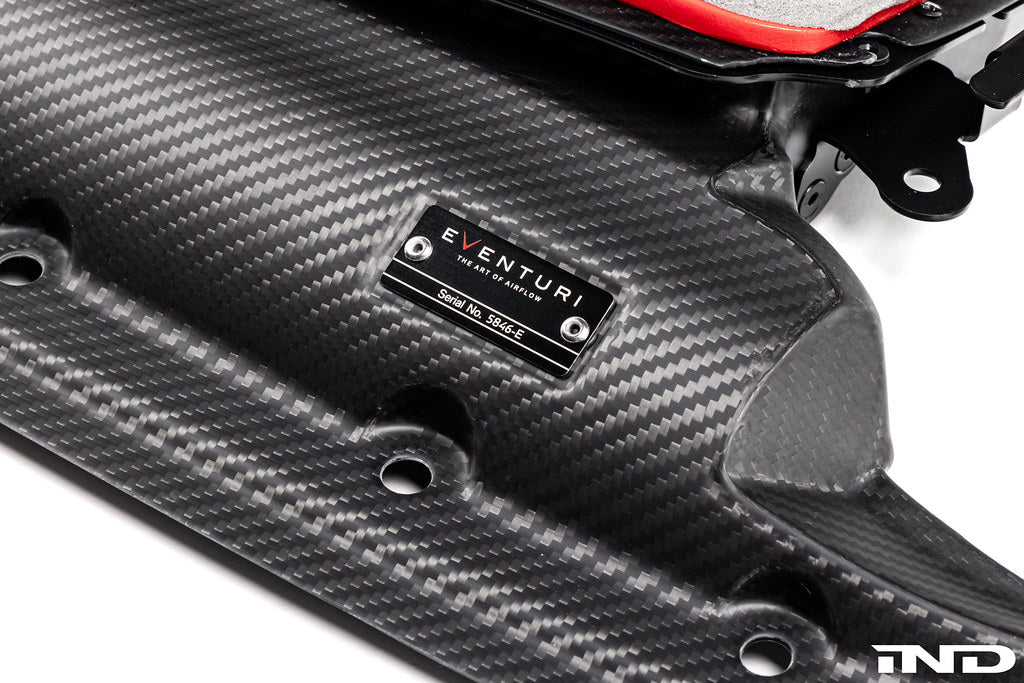 Eventuri black carbon intake system for Audi C8 RS6 and RS7, performance upgrade with sleek matte finish on a white background.