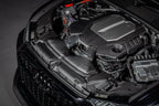 Eventuri black carbon intake system installed in engine bay of Audi C8 RS6 and RS7, showcasing performance air intake components.