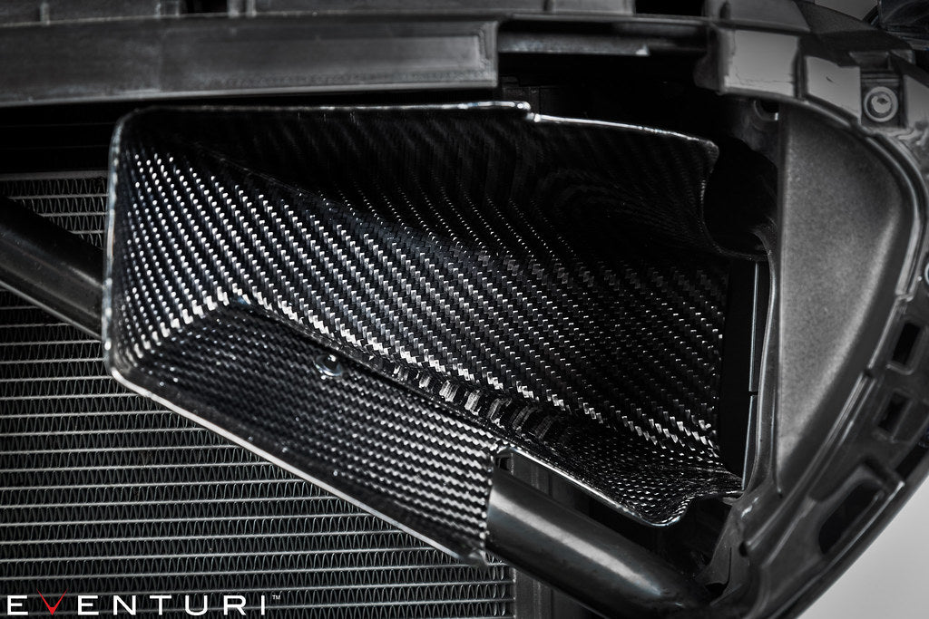 Close-up of the installed Eventuri carbon fiber intake scoop on a BMW F90 M5 and F9X M8 showing the airflow inlet and pre-preg carbon fiber construction.