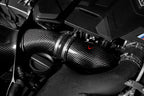 Eventuri BMW F90 M5 and F9X M8 carbon turbo inlet set installed in engine bay, showcasing performance engine components.