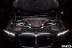 Eventuri black carbon intake system installed in BMW F95 X5M G09 XM engine bay, showcasing performance air intake components.