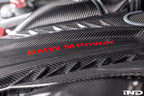 Eventuri black carbon intake system installed in BMW F95 X5M with S63 engine, showcasing performance air intake in the engine bay.