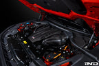 Eventuri black carbon intake system installed in engine bay of BMW F95 X5M, F96 X6M, G09 XM, and M60i performance vehicle