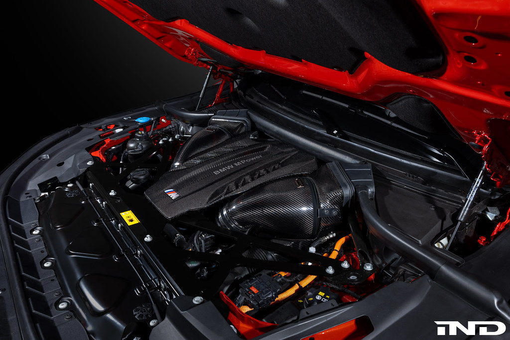 Eventuri black carbon intake system installed in engine bay of BMW F95 X5M, F96 X6M, G09 XM, and M60i performance vehicle