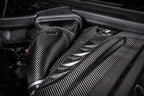 Eventuri black carbon intake system installed in BMW F95 X5M G09 XM G06 M60i engine bay, showcasing performance upgrade.