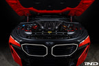 Eventuri black carbon intake system installed in BMW F95 X5M G09 XM engine bay, showcasing performance air intake components.