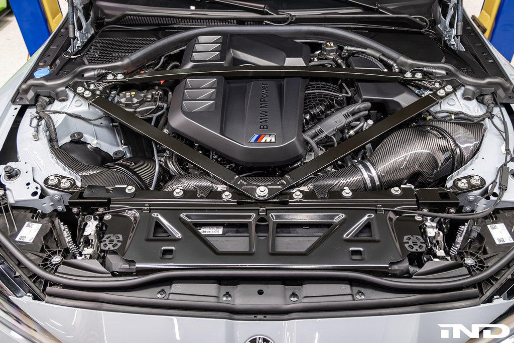 Eventuri black carbon intake system for BMW G8X M2, M3, M4 S58 engine installed in engine bay, V2 performance upgrade.