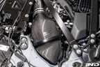 Eventuri black carbon intake system for BMW G8X M2, M3, M4 S58 engine installed in engine bay, V2 performance upgrade.