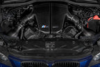 Overhead installed view of Eventuri BMW S85 carbon plenum system in BMW V10 engine bay