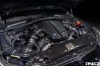 Overhead off center engine bay view of Eventuri S85 carbon plenum system installed on BMW V10 engine with optional intake 